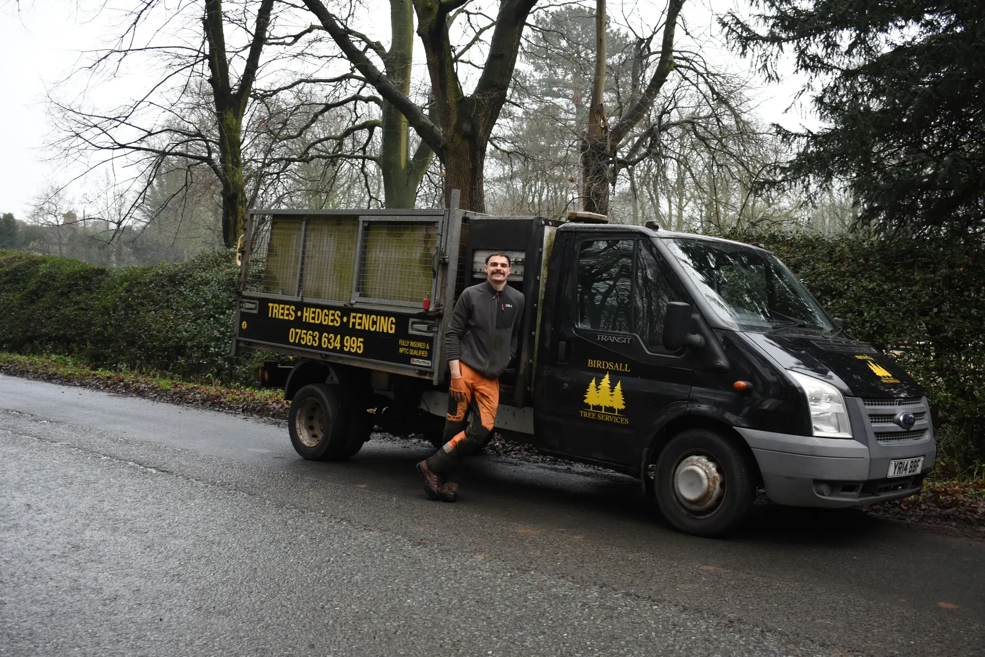 Jack Birdsall beside the branded Birdsall Tree Services tipper truck
